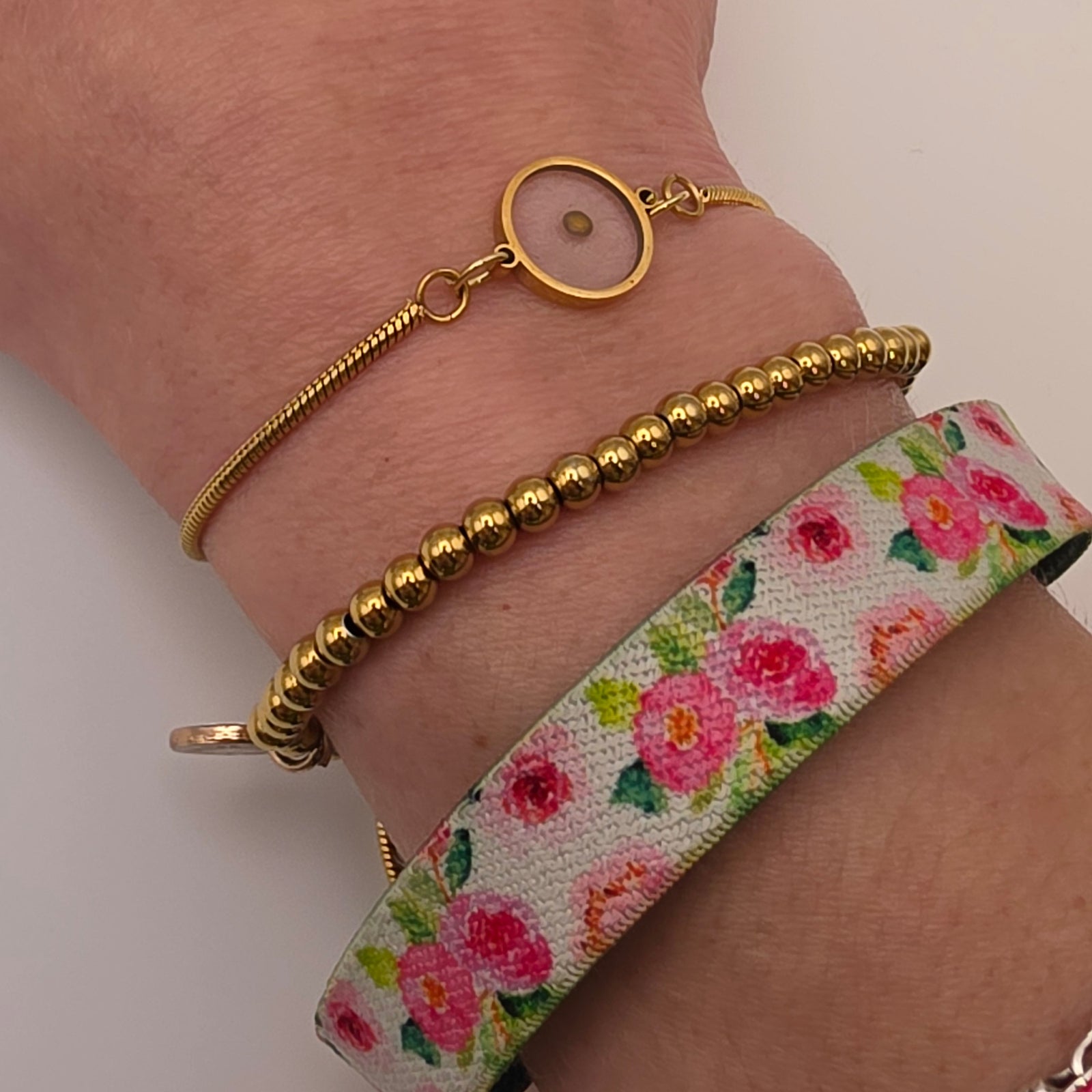 Mustard seed gold slider bracelet on wrist, byPink Salt Riot