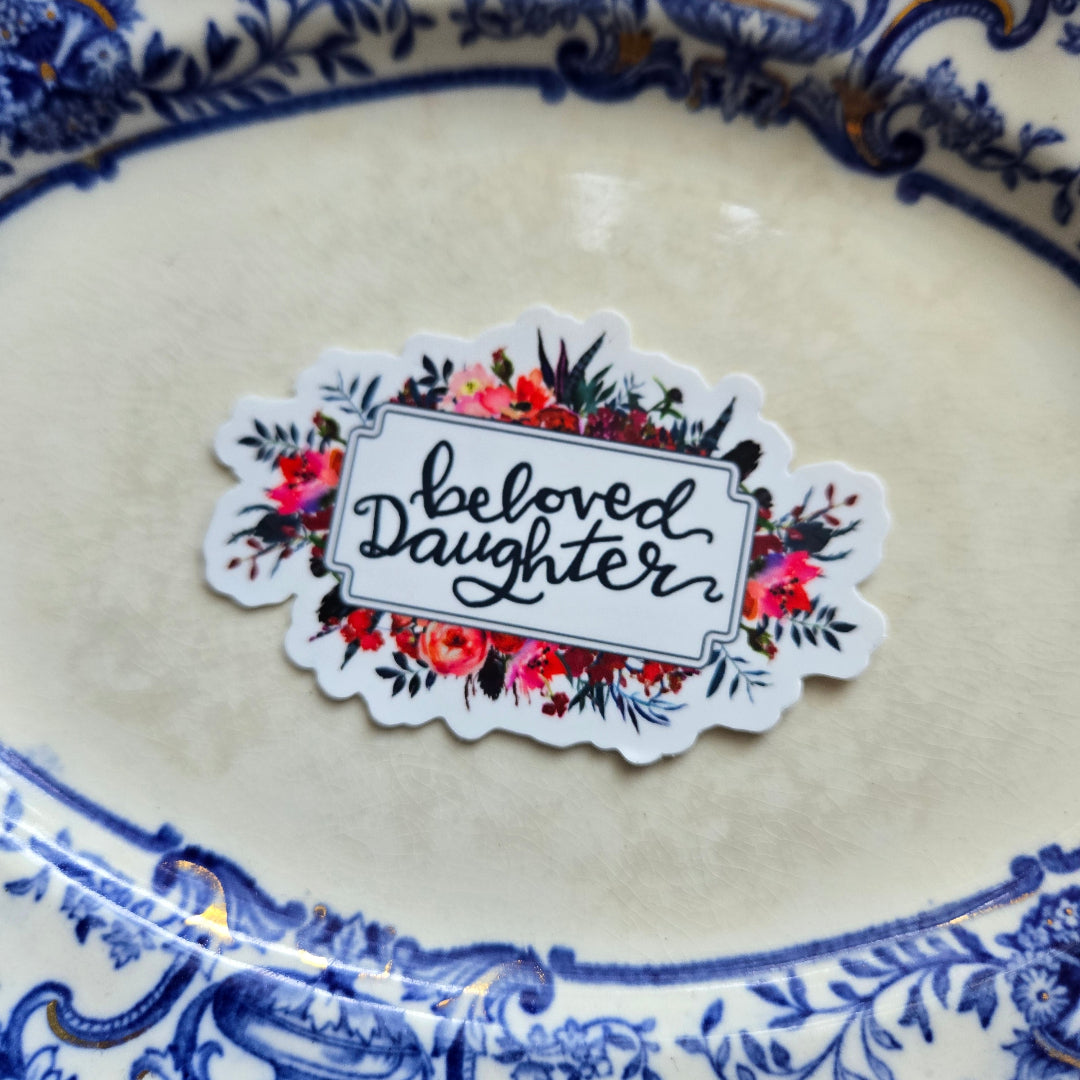 Beloved Daughter vinyl sticker on a plate