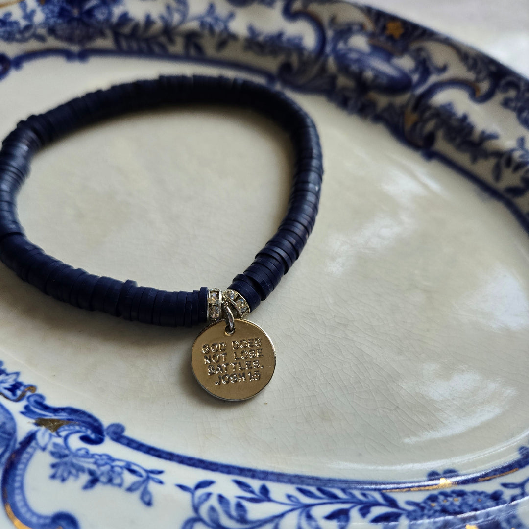 He Will Not Fail Me Navy Clay Heishi Bracelet-Pink Salt Riot- back of charm on plate