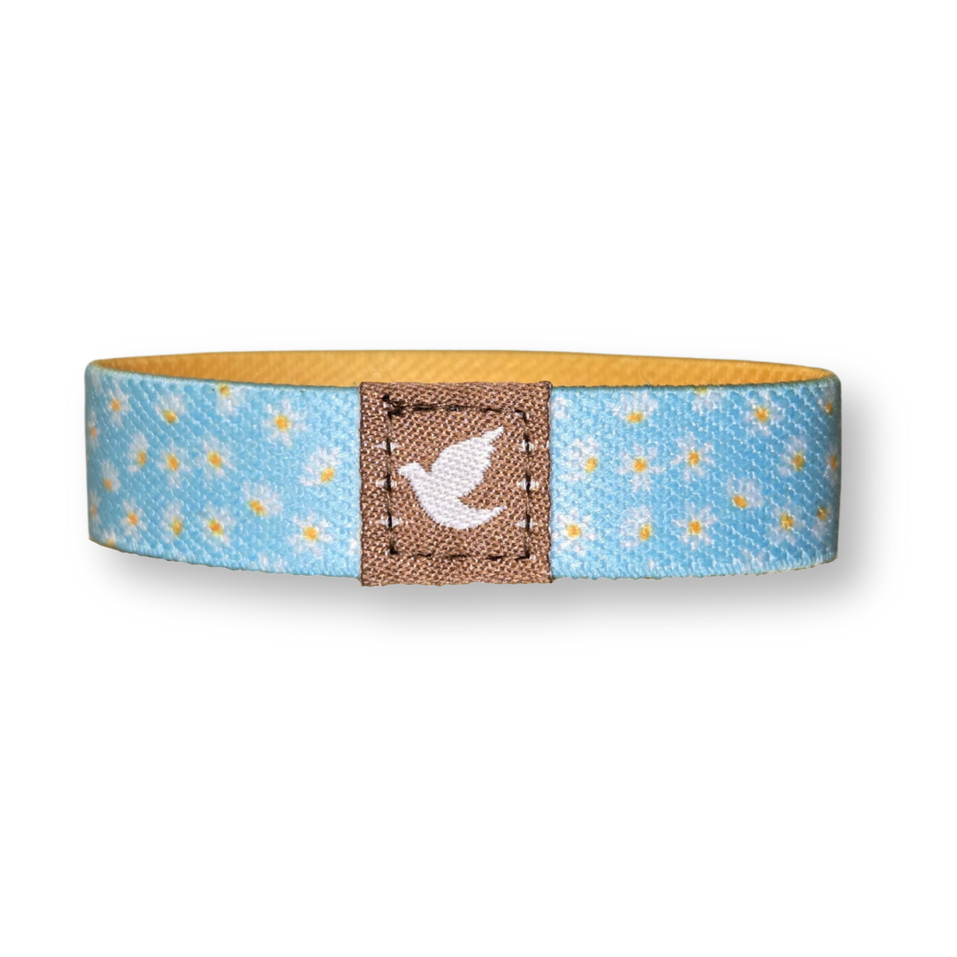 Pink Salt Riot inspirational Christian wristband for girls with a blue floral design and white dove emblem