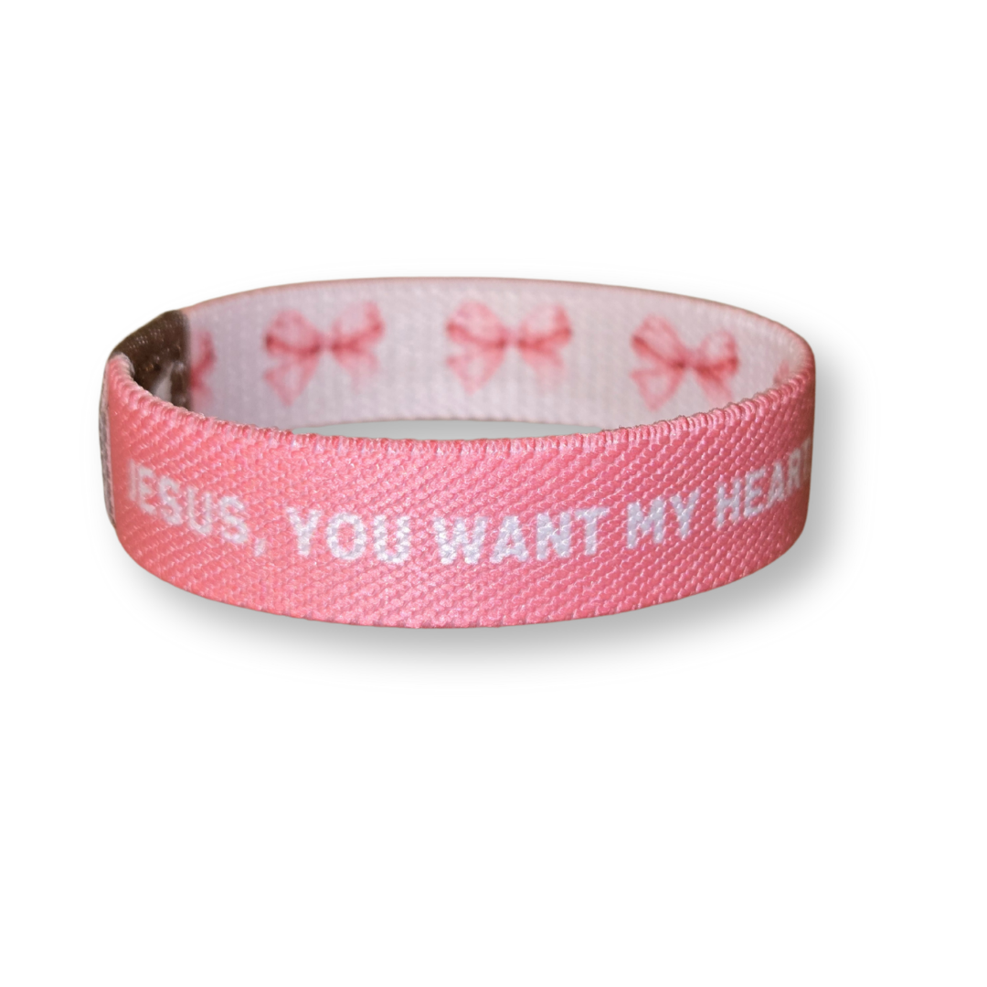 Pink Salt Riot Christian girls bracelet with pink fabric and white text for faith expression