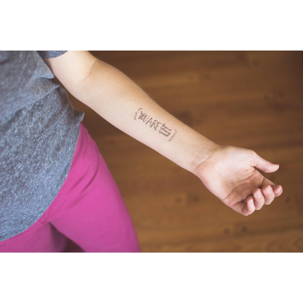 Christian Temporary Tattoos Set - Created for Love applied on forearm of person wearing gray shirt and pink pants