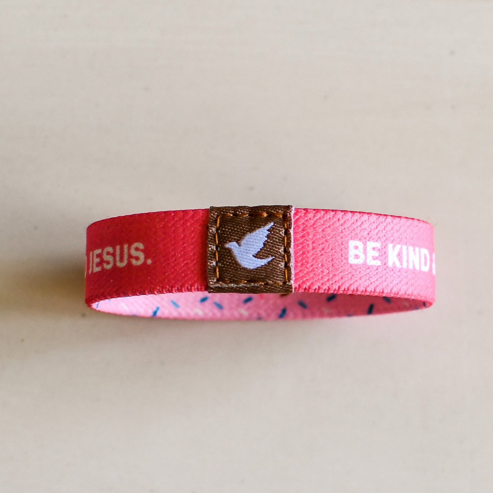 Pink Salt Riot Christian kids bracelet in pink with white dove and inspirational text design