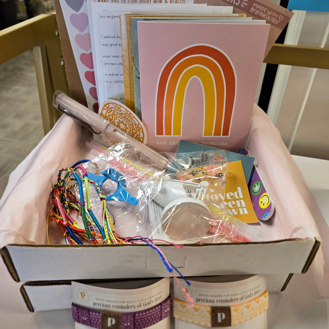 Pink Salt Riot summer camp care package for girls bundle with colorful bracelets, cards, stickers, and small gifts