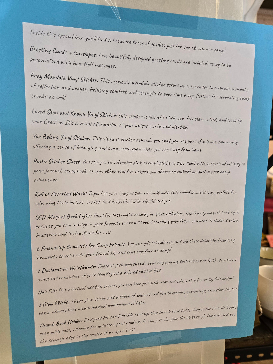 Pink Salt Riot summer camp care package for girls with greeting cards, stickers, and friendship bracelets- description of contents